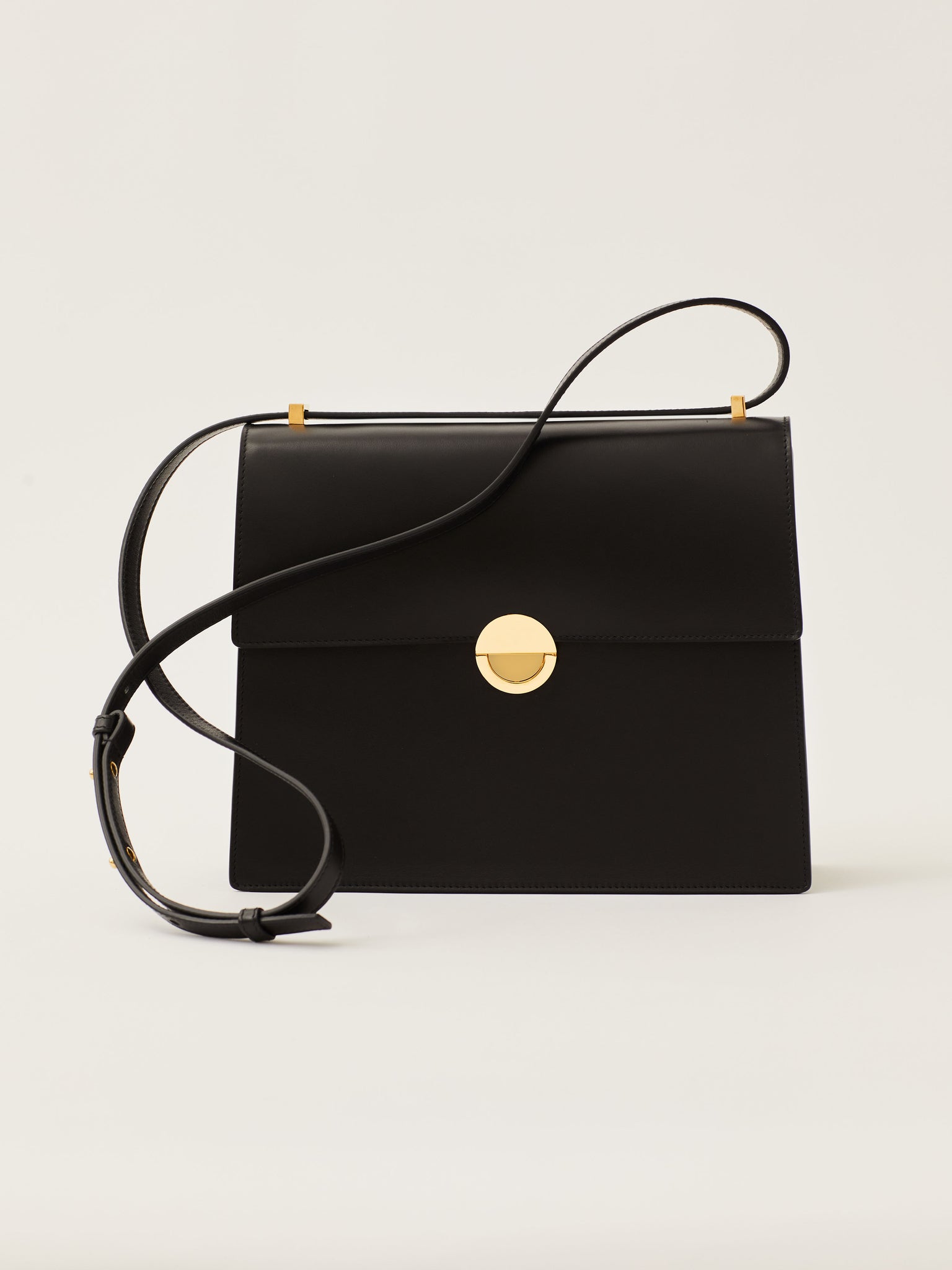 Objets Daso Hye Handbag in Black Leather: Front View with Shoulder Strap On Top